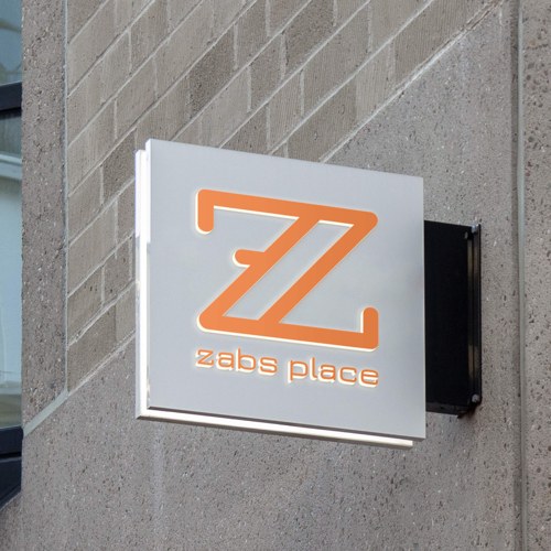The ZABS Place storefront sign